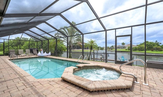 Cape Coral Casa | Canalfront/Outdoor Kitchen/Pool/Spa/Boat Dock