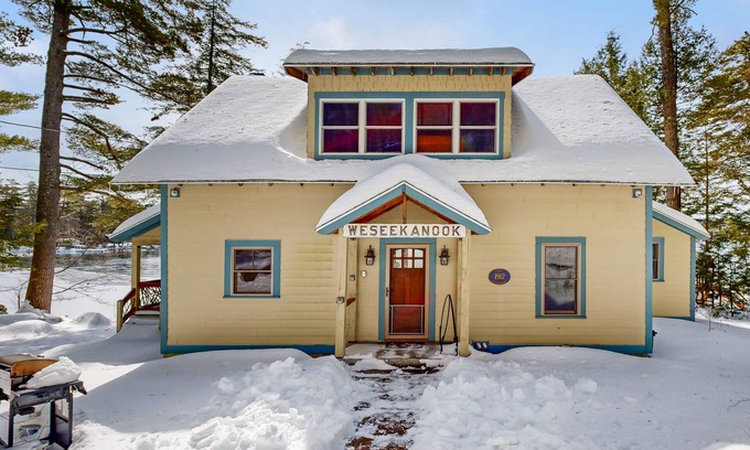 Meredith Casa | Captivating lakefront home with private dock, row boat, firepit, and lake views