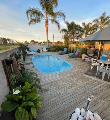 Capao da Canoa Casa | Casa ampla com área gourmet e piscina