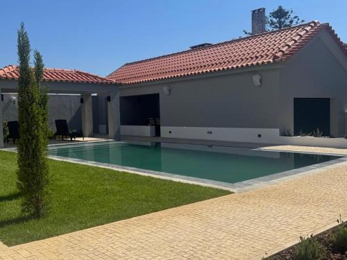 Faulha Casa | Casa com jardim perto da praia