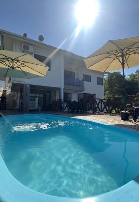 Piratuba Casa | Casa dos Gerânios com Piscina - 4 Quartos climatizados, espaçosa ideal para encontro de grupos e familiares, próximo do Parque Termal!