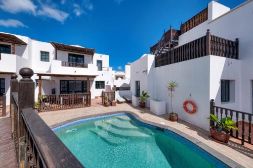 Punta Mujeres Casa | Casa Hibiscus - Shared Pool and BBQ - Close to Seafront Promenade By Lanzarote Vacation Homes