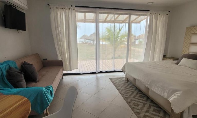 Monitos Casa | Casa Suite Palmar del viento FRENTE, FRENTE AL MAR by Amauna