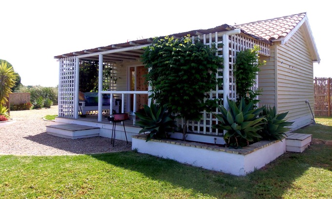 El Palmar Cabaña | Casita Chau, elegante casa de madera de 1 dormitorio.