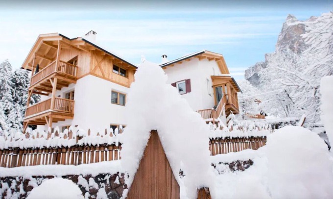 Siusi Villa | Chalet Baita, is seen at the foot of Seiser