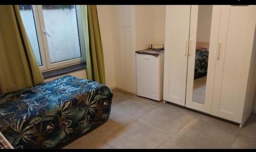 Collignon Casa | Chambre deux lits célibataires sous -sol cle ancien