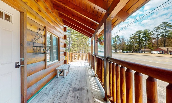 Arbor Vitae Cabina | Charming lakefront cabin with fireplace, cozy interior, streaming, & partial AC