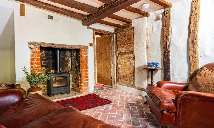 Ipswich Cabaña | Charming medieval cottage courtyard garden and wood burner in serene Kersey