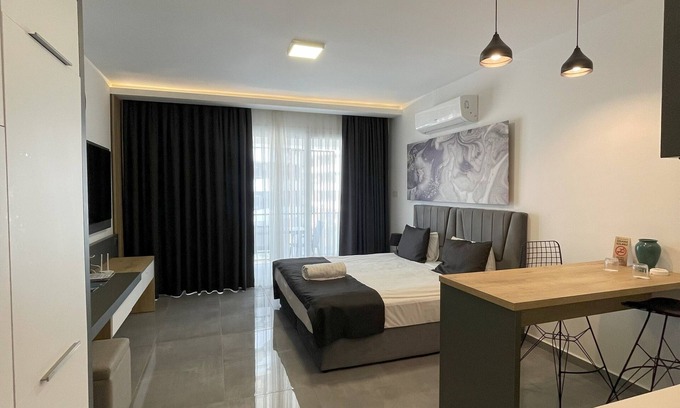 Trikomo Apartamento | Charming studio with pool, sauna, gym, airco, TV, kitchen & stylish design