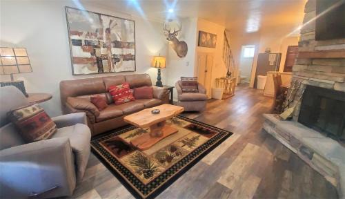 Red River Casa | Claim Jumper Townhouse 07 - On the River - Across from the Fishing Ponds - WiFi - Cable - Near Ski Area - Wood Burning Fireplace
