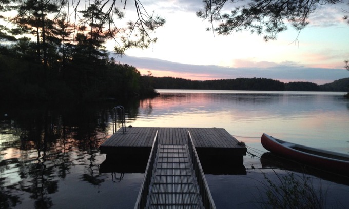 Camden Cabina | Classic lakefront family camp in Camden; large porch, dock & boats