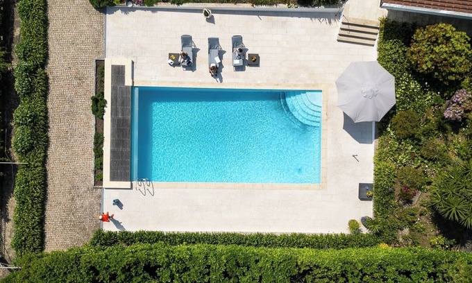 Paredes Casa | Classic Villa w/ Gym and Pool Access by HostWise