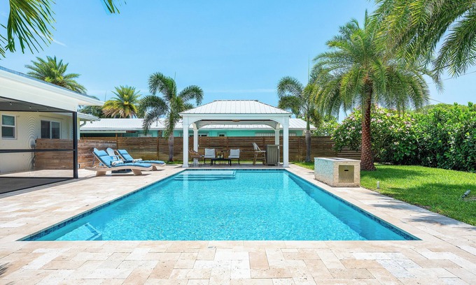 Hunt Club Casa | Clean Florida Coastal Design home with Heated Pool, Fireplace and Putt Putt