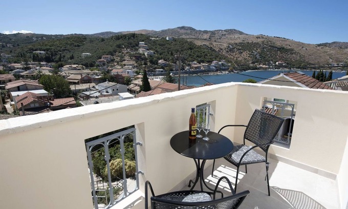 Kassiopi Apartamento | Close to the beach, spacious one-bedroom apartment with sea views.