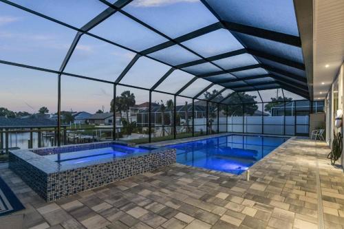 Palm Harbor Casa | Coastal Paradise Waterfront Pool Home