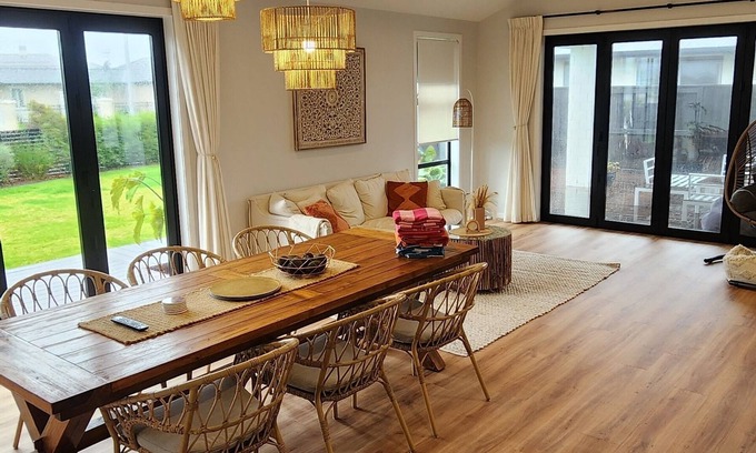 Papamoa Beach Casa | Coastal spacious 4-bedroom house close to beach with spa.