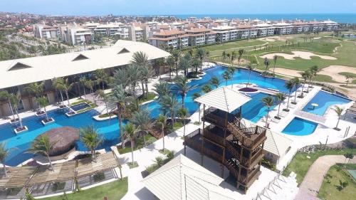 Porto das Dunas Apartamento | Cobertura no Golf Ville deck privativo com jacuzzi e churrasqueira