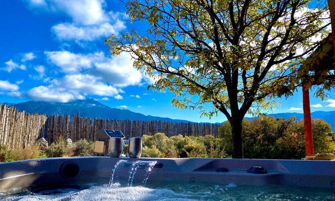 Taos Casa | Colorful dog-friendly home with sweeping views, a private hot tub, & large yard