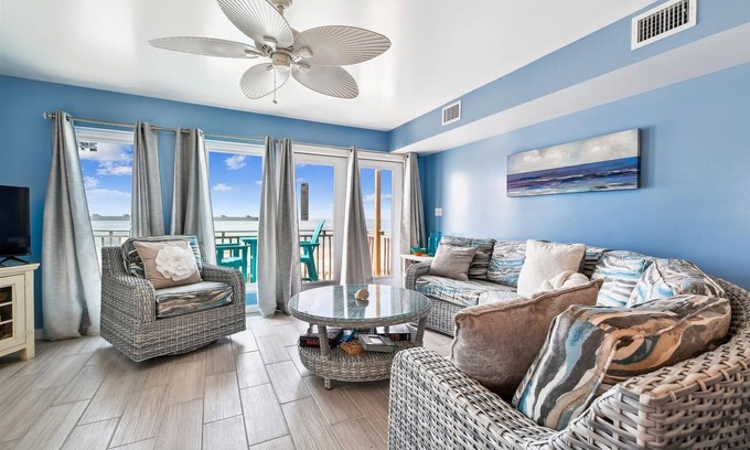 East End Casa | COME AND ENJOY this beautifully decorated beachfront townhome where you can soak up the sun!
