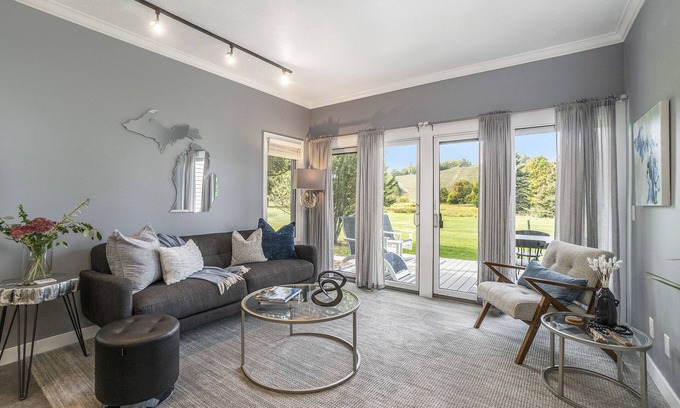 Cedar Condominio | Come cozy up next to the fireplace at our contemporary condo centrally located