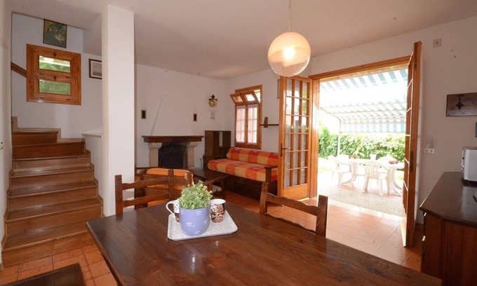 Bibione Pineda Villa | Cómoda villa enclavada en un paisaje verde.