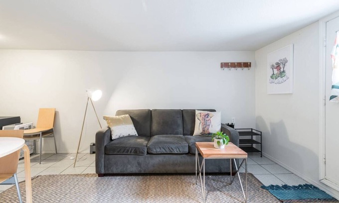 Kensington-Cedar Cottage Casa | Cool, cozy and modern space with a garden patio to enjoy meals in sunny weather.