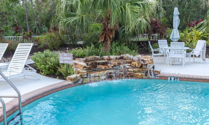 Ole Condominio | Coral Falls - 1st floor condo - private screened lanai w/views of indoor 65" TV & steps to pool/spa