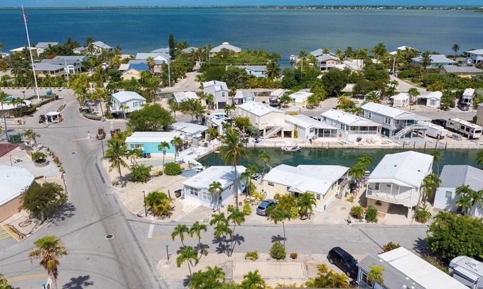 Cudjoe Key Alquiler De RV | Corner RV Lot with Lagoon Views, Palm Trees, and Steps to Pool & Amenities