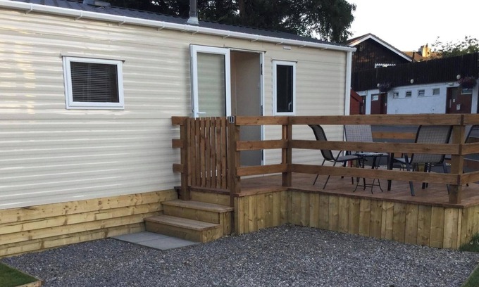 Boat of Garten Casa | Cosy chalet - Poppy Lodge in Boat of Garten, Dog Friendly, free wifi!