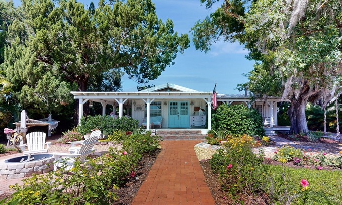 Buckingham Cabaña | Countryside cottage with firepit, garden views, French-country decor, & hammock