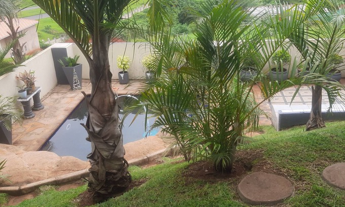 Kingsburgh Casa | Cozy one bedroom suite, with a balcony, overlooking the pool and braai area.