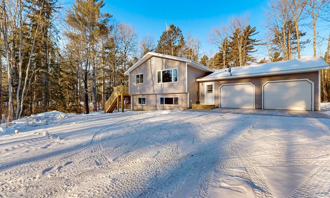 Presque Isle Casa | Cozy tree-lined home located near town, lakes, walking & bike trails, w/ firepit