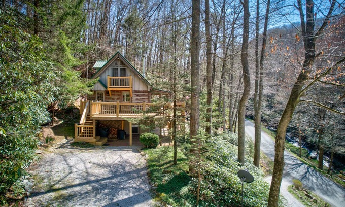 Elk Park Casa | Creeksong Cabin - log home with fire pit, large creek on property