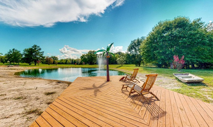 Waller Casa | Custom Home with Guesthouse, Pond, Swimming Deck, Beach & Tropical Bar