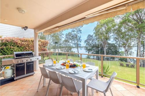 Corlette Casa | Danalene, 44a Danalene Pde - stunning waterfront property with Air Con, WI-FI, Double Lock Up Garage & Boat Parking