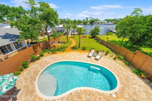 Holiday Beach Casa | Dancin on the Waves On Lagoon Boat dock, Pool, Firepit
