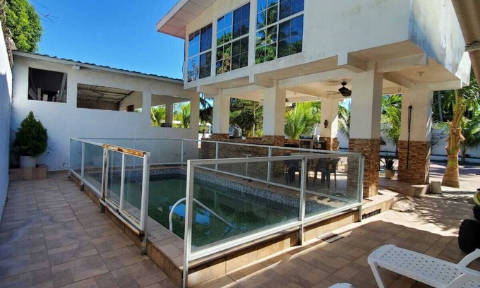 Playa San Diego Complejo | Deluxe bedroom with 4 queen beds, accommodates 8 guests, located in El Tenis.