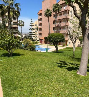 Arenales del Sol Apartamento | Descanso y jardines con piscinas