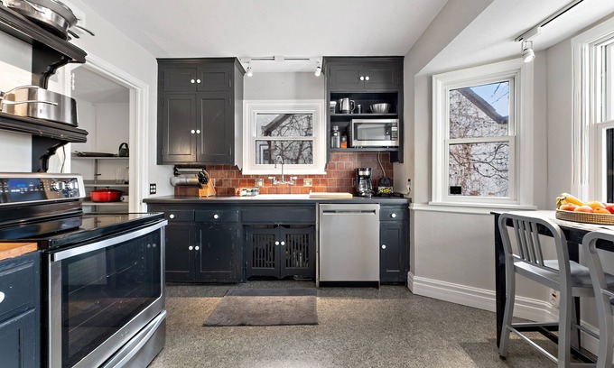 St. Louis Park Casa | Designer 4B home w/ office, fenced-in yard, & gas fireplace