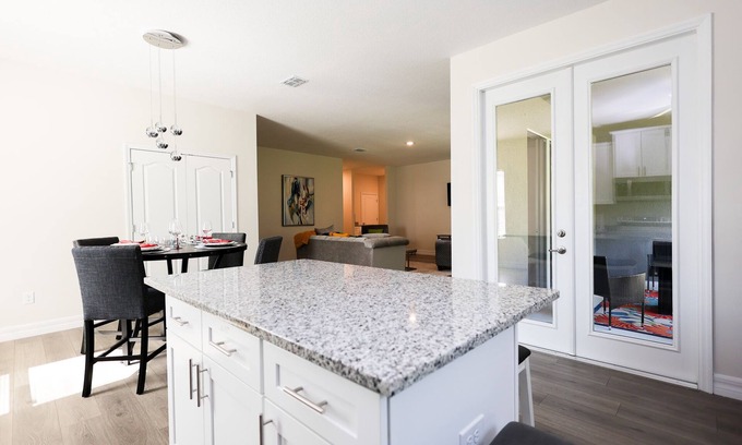 Palm Bay Casa | Discover Palm Bay by staying at this picturesque four-bed, three-bath home.