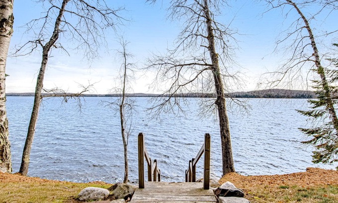 Presque Isle Cabina | Dog-friendly cabin with waterfront views, lake access, sandy beach, & rec room