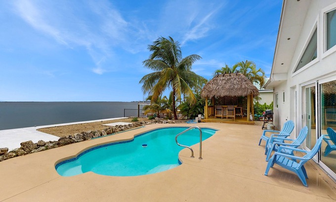 Tropical Bay Estates Casa | Dog-friendly home with waterfront views, a pool & Wifi