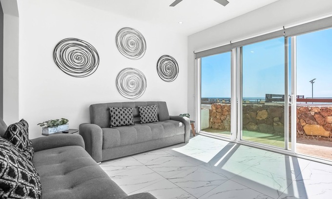 La Paloma Casa | Dog-friendly home with heated pool, hot tub, partial ocean views, & balcony