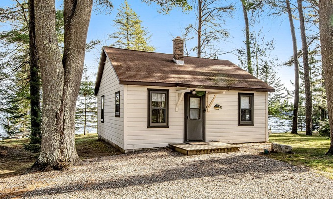 Presque Isle Cabina | Dog-friendly lake cabin with waterfront views & on-site swimming/fishing/boating