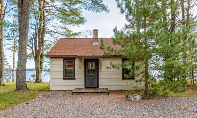 Presque Isle Cabina | Dog-friendly lakefront cabin with on-site swimming, fishing, & rec room