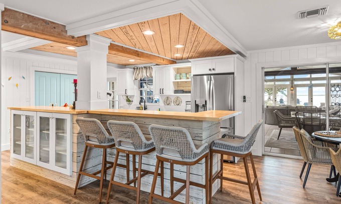 Bay Point Casa | Dog-friendly waterfront home with outdoor kitchen, bar, firepit, & kayak launch