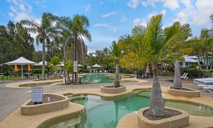 Cams Wharf Villa | Elysian Escape - 4 Pools, Lakeside, Raffertys Resort