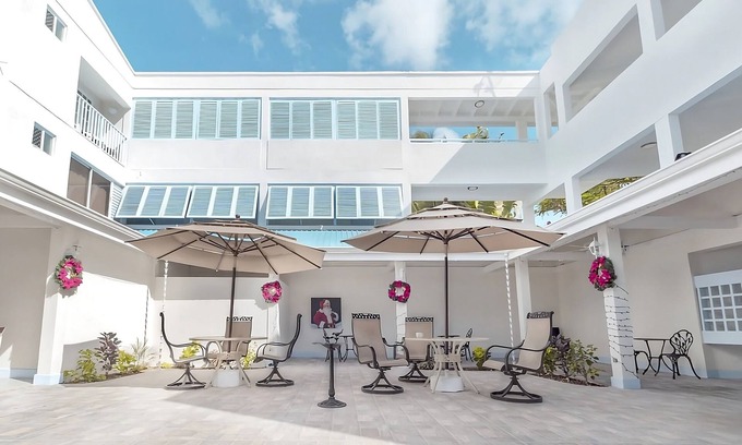 St. Lawrence Gap Hotel | Enjoy Great Games and Events at Garrison Savannah! FREE Parking, Outdoor Pool!