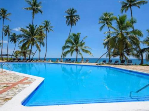 Villas Del Mar Apartamento | Estancia Nana apartamento vista al mar piscina WIFI cocina completa aire acondicionado Lavadora secadora