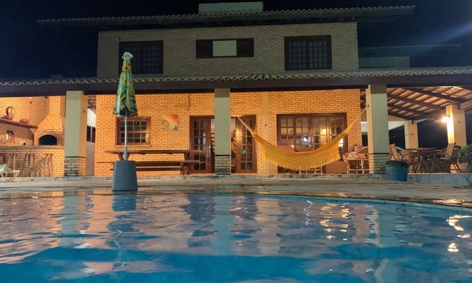 Loteamento Parque das Fontes Casa | Gran casa en la playa con vistas al mar, piscina con cascada y terraza